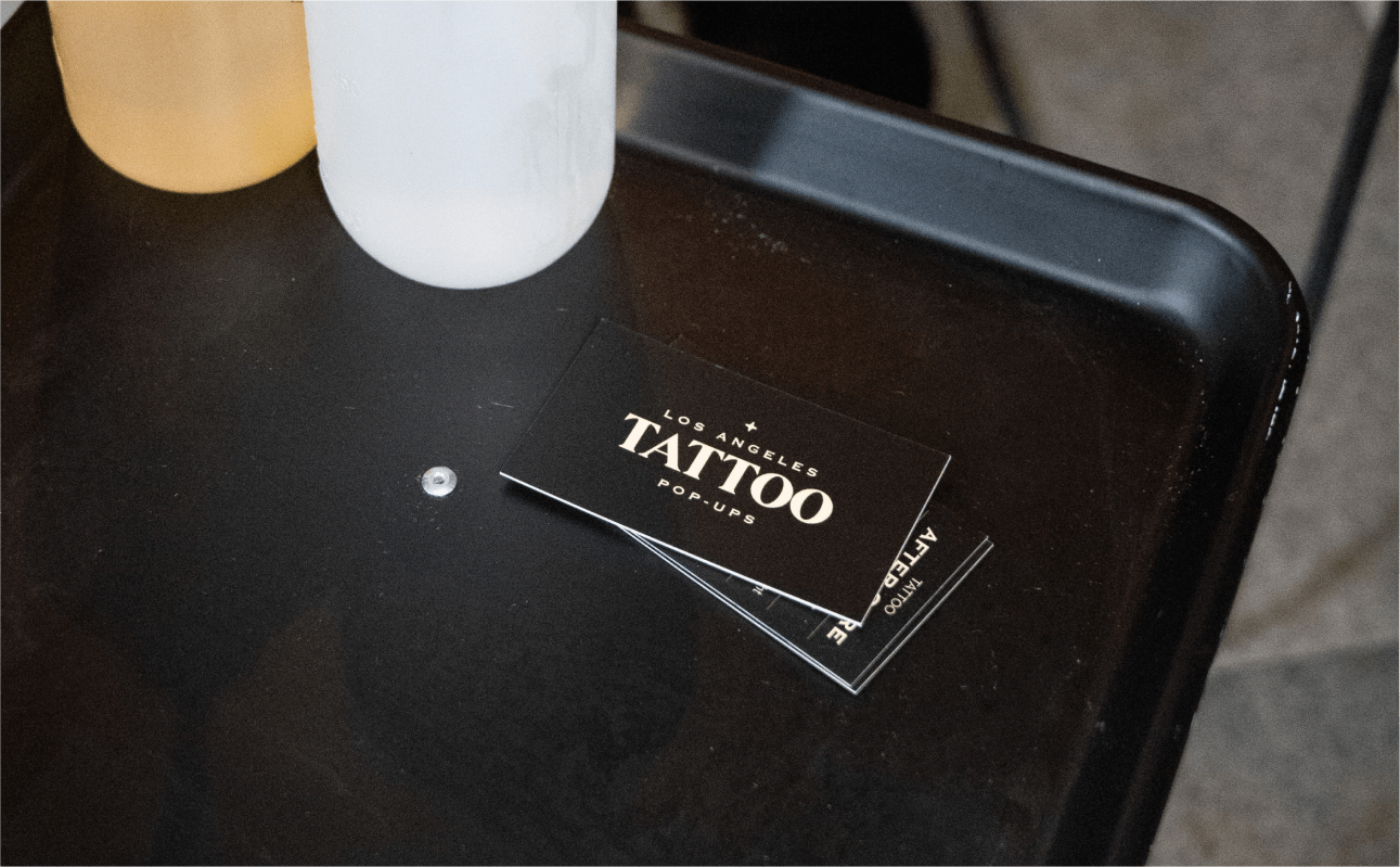 Tattoo artist setting up their station at a wedding event, ready to create personalized tattoos for guests to commemorate the celebration.